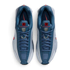 Bliss sneakers Nike Shox R4 mavi ve kırmızı detaylı, üstün yastıklama teknolojisine sahip modern spor ayakkabı.