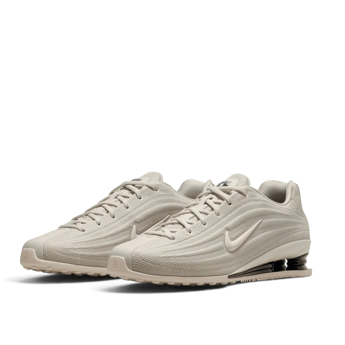 Bliss sneakers Nike Shox Ride 2 bej renkli, nefes alabilen file yüzeyli ve topuk yastıklamalı günlük spor ayakkabı.