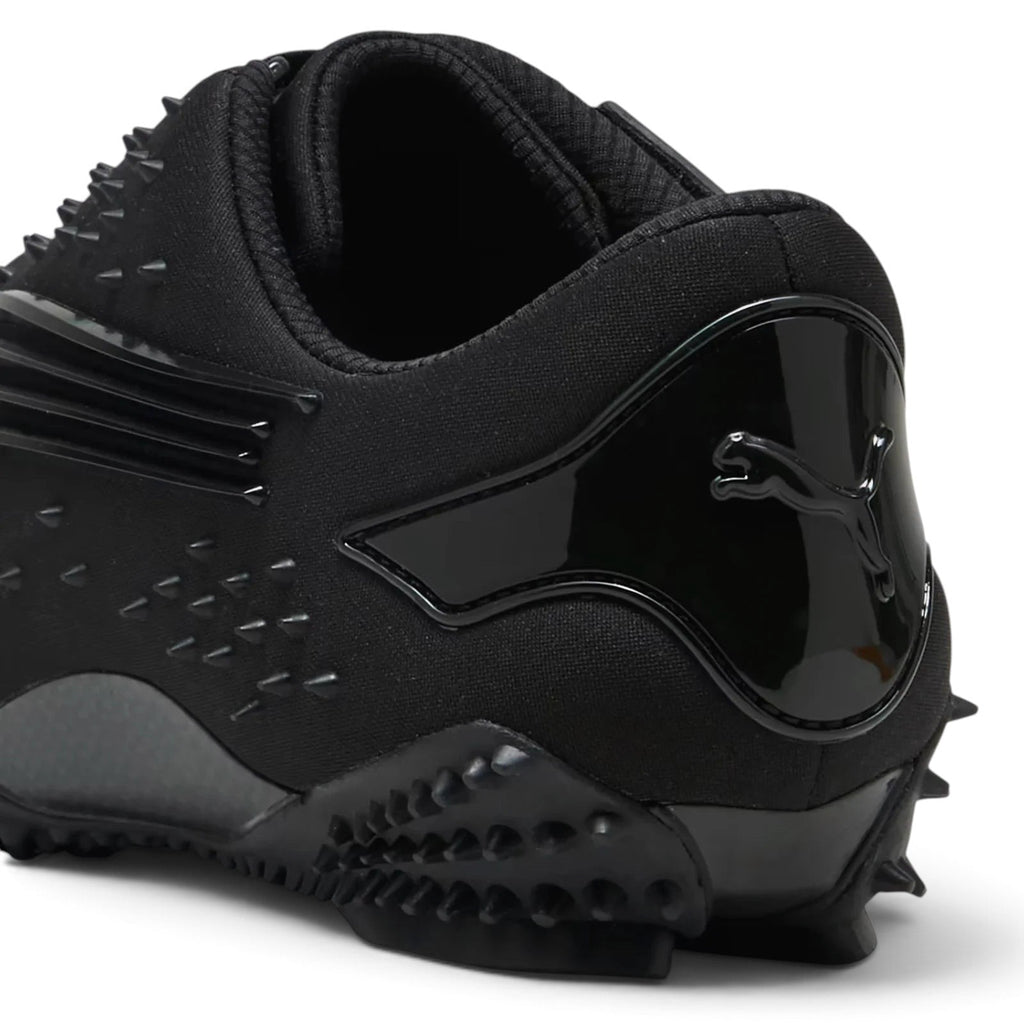Bliss sneakers PUMA Mostro siyah çivili detaylara sahip fütüristik tasarımlı günlük spor ayakkabı topuk detayı