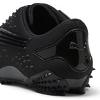 Bliss sneakers PUMA Mostro siyah çivili detaylara sahip fütüristik tasarımlı günlük spor ayakkabı topuk detayı