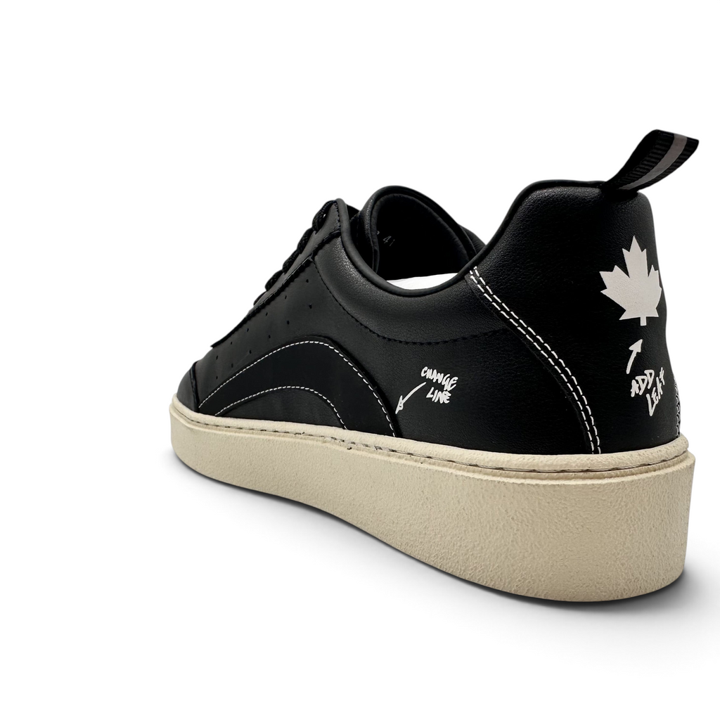 Bliss sneakers siyah deri erkek spor ayakkabı, beyaz dikiş detayları, topukta yaprak figürü ve krem rengi taban.